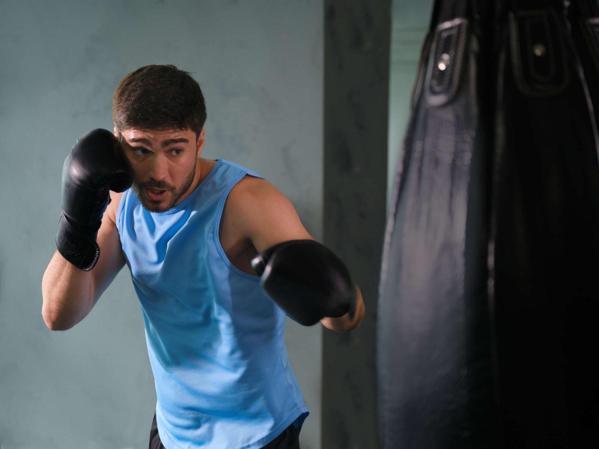 Pullman Jakarta Central Park Εξωτερικό φωτογραφία A boxer training with a heavy bag