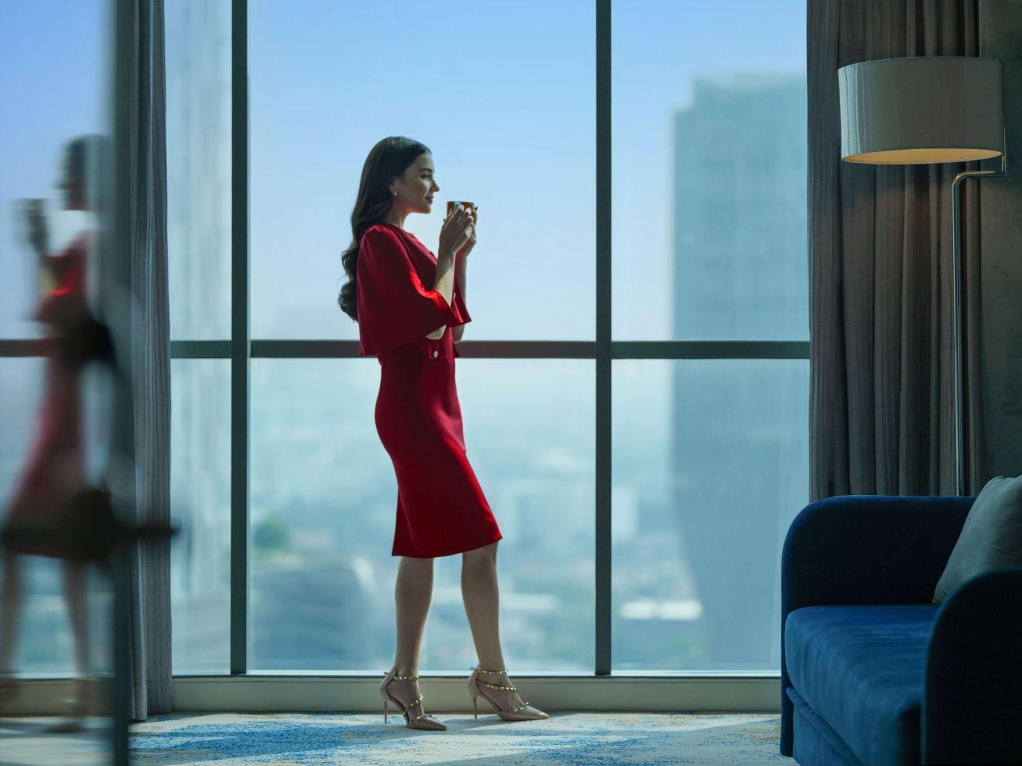 Pullman Jakarta Central Park Εξωτερικό φωτογραφία A woman in a red dress