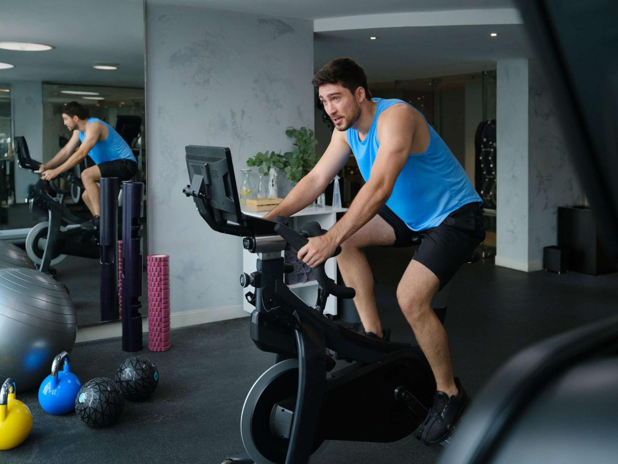 Pullman Jakarta Central Park Εξωτερικό φωτογραφία A man on a stationary bicycle